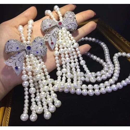 Exaggerated blue red zircon large bow hollow pendant long natural pearl necklace female high jewelry necklace birthday gift