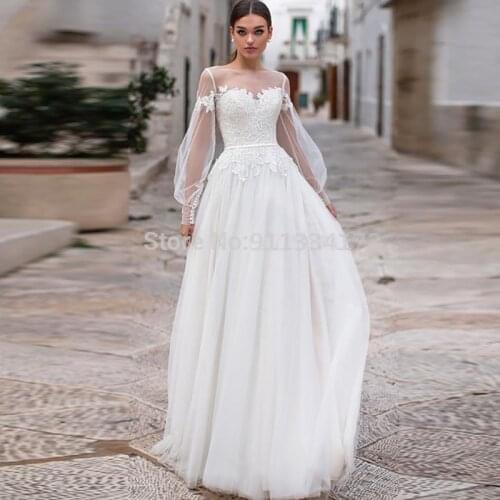 Boho Wedding Dresses 2021 Lace Appliques Puff Long Sleeves Wedding Gowns Button Backless Floor Length Vestido De Noiva
