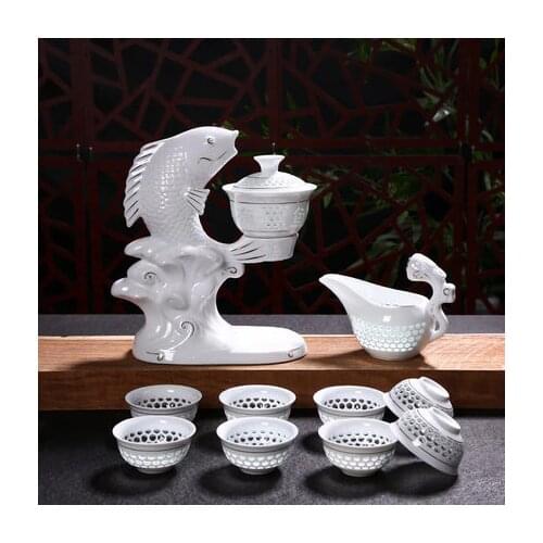 Automatic White Ceramic Hollow Transparent Blue and White Tea Pot Cup New Jingdezhen Fish Porcelain Dehua Kung Fu Tea Set Cups