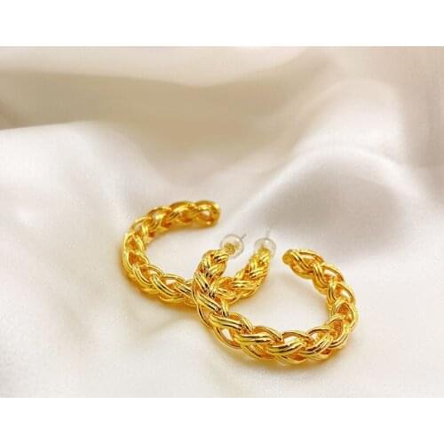 The new European and American gold fashion earrings womens geometric retro earrings woven hollow earrings