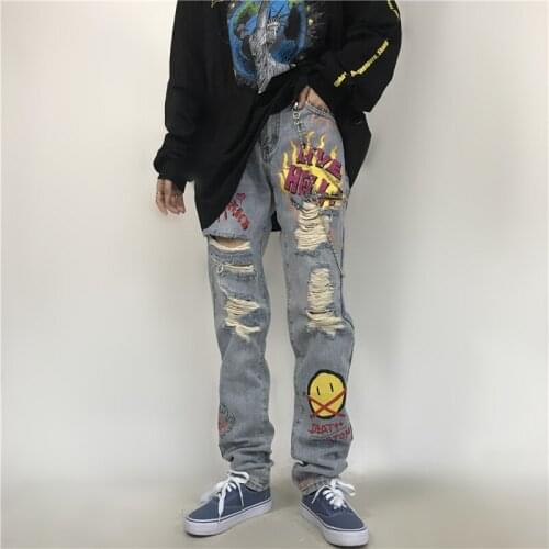 Mens and womens jeans high street national tide hip-hop music smiley hole hand-painted graffiti print denim trousers