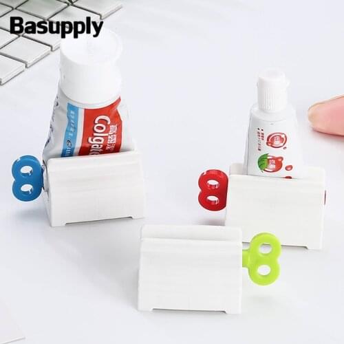Basupply 1Pc Multifunction Rolling Toothpaste Squeezer Stand Holder Plastic Bath Dispenser Bathroom Accessories