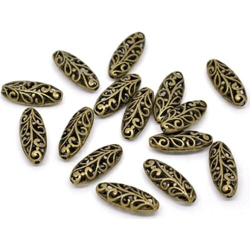 DoreenBeads 2 PCs Zinc Based Alloy Spacer Beads Oval Antique Bronze Flower Hollow Carved For Jewelry Making 23mmx9mm Hole:1.2mm