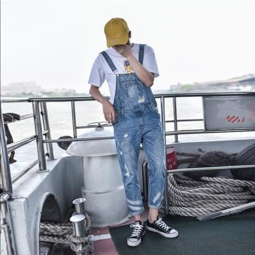 Summer New Suspenders Men Fashion Tide Hole Jeans Trouser Denim Jumpsuit For Men Bib Pants Singer Overalls Stage Costumes
