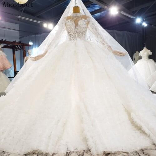 Luxury Feather Ball Gown Wedding Dress 2021 High Collar Long Sleeve See Through Top Beads Wedding Gown with Cathedral Train