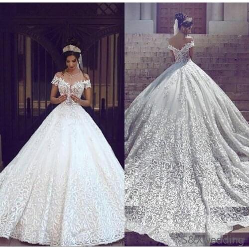Saudi Arabic Dubai 2020 Luxury Short Sleeves Wedding Dresses Off Shoulder Appliques Backless With Sweep Train Bridal Gowns Robe