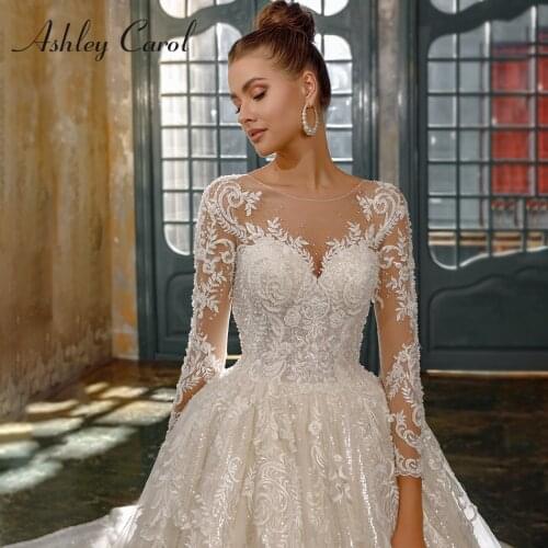 Ashley Carol Luxury Ball Gown Wedding Dresses 2021 Long Sleeve Crystal Appliques Lace Up Cathedral Wedding Gown Vestido De Noiva