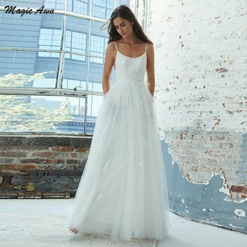 Magic Awn 2021 Tulle Wedding Dresses Boho Lace Appliques Spaghetti Straps Beach Mariage Gown Open Back Pockets A-Line Vestidos