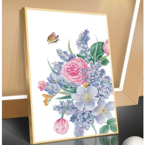 Traditional DIY handmade cross stitch as a gift for mother Butterflies flying in the flowers Christmas decoration painting