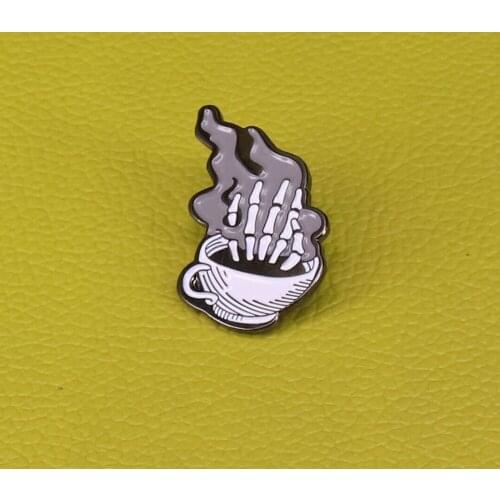 Dead Coffee Gothic Brooches Representing a skeleton hand coming out of a hot cup of coffee