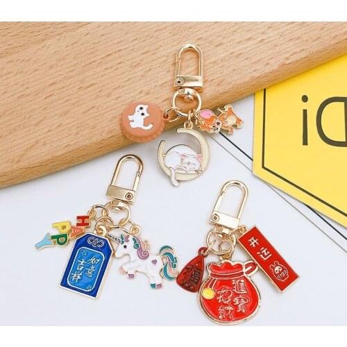 Alloy drop oil Unicorn transport key chain creative bag Car Key Pendant Gift