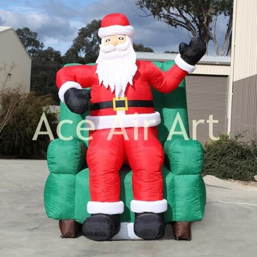 Christmas party decoration inflatable Santa Claus sit sofa and Say Hello to U for sale
