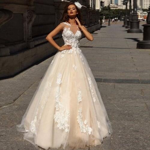 Romantic Lace Applique Wedding Dresses A Line O Neck Floor Length Champagne Bridal Gowns Sexy See Through Top Brides Dress 2020