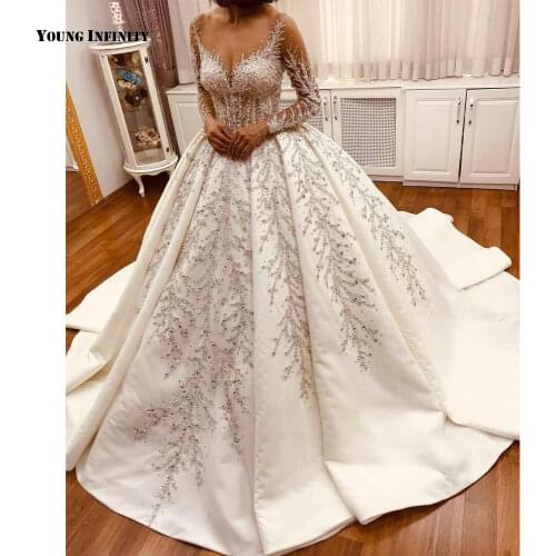 Luxury Ball Gown Wedding Dresses 2021 Long Sleeves Bridal Gown Illusion Back Scoop Chapel Train Beaded White Plus Size Bride