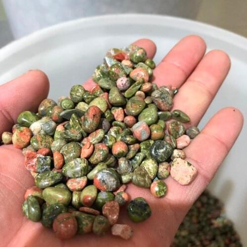 Red and green placer and gravel natural crystals