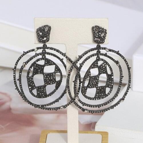 Diamond check pattern eye sockets hollow round spiral exaggerated earrings