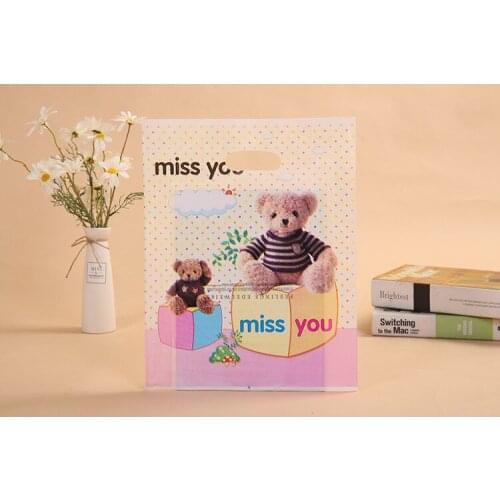 100psc Handbag clothing plastic handbag bag hand bag four finger bag clothing store bag