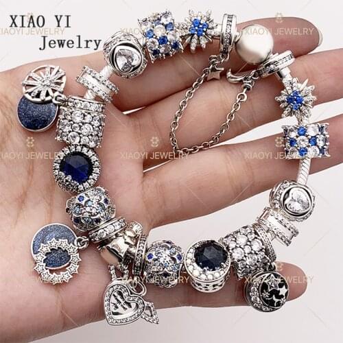 XIAOYI 100% S925 Blue big string of stars and moon angel wings snowflake fashion string ornaments high quality bracelet female