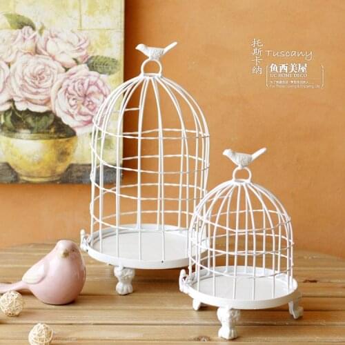 White birdcage candlestick wedding decoration