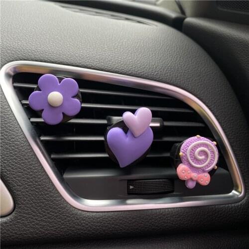 A set of candy, color flowers, love lollipop, car outlet, perfume, car aromatherapy, air conditioner, decorative clip