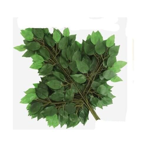 Banyan leaves are over plastic, plastic fig branches, green plants, leaves and false branches.christmas decorations for home