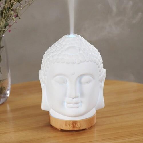 New Desgin Statue Of Buddha Pattern 100ml Aroma Diffuser Essential Oil With 7 LED Ceramic Materila Ultrasonic Air Humidifier