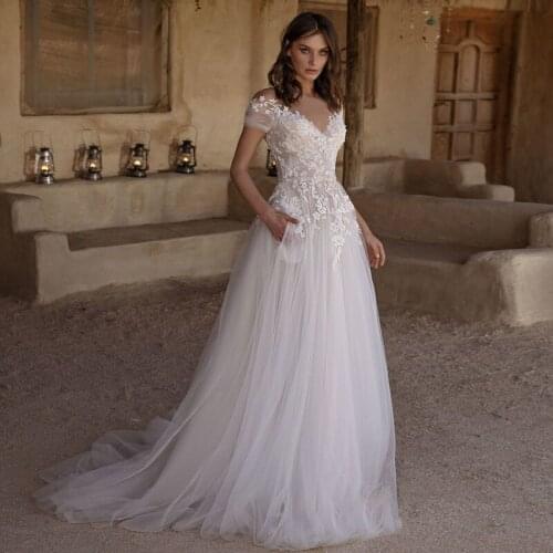 Charming V-Neck Wedding Dresses 2021 Short Sleeve A-Line Lace Appliques Button Tulle Boho Bridal Gown Sweep Train With Pocket