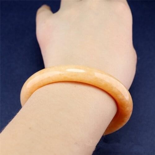 China Natural Hand Carved Round Beige Topaz Bracelet Fashion Boutique Jewelry Mens and Womens Sunset Red Bangle