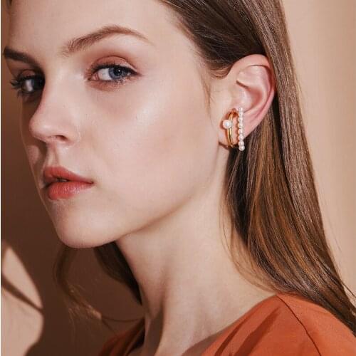 INS personality fashionable temperament single pearl asymmetric one-piece ear clip exquisite earring design sense