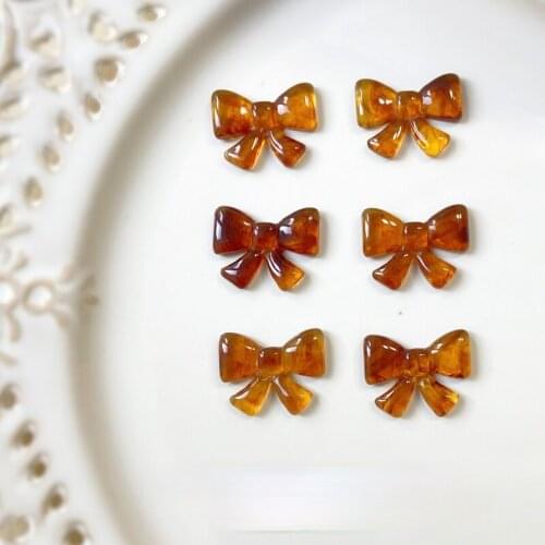 Autumn and winter retro amber porous bow knot resin jewelry material DIY earrings studs accessories materials