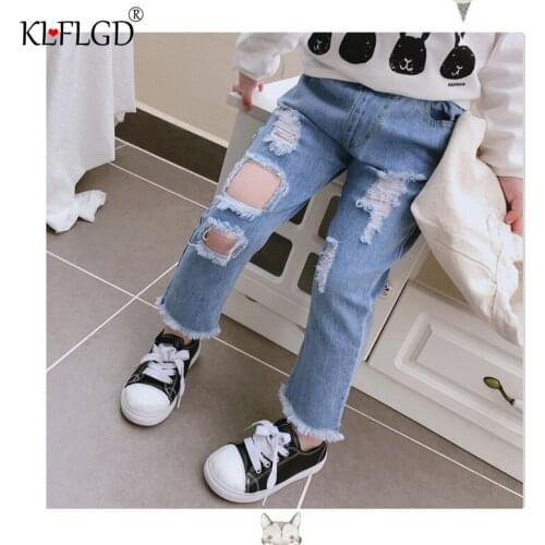 Summer new childrens solid color pierced jeans mens and womens fashion personality tassel casual pants pants