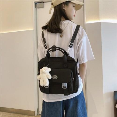 New Japanese Womens Backpack Cute Doll Pendant Solid Color Messenger Bag Nylon Waterproof School Backpacks