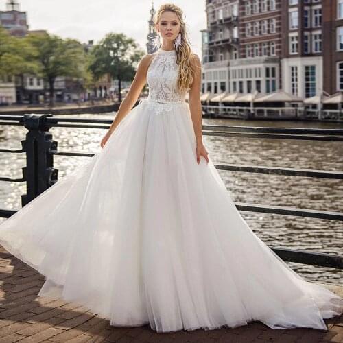 Charming Lace Appliques Halter High Neck Wedding Dresses Sexy Off the Shoulder Sleeveless Open Back Boho Bridal Gowns