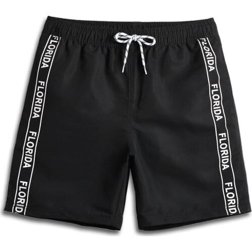 Solid color letter mens beach pants outdoor leisure quick drying shorts mens holiday beach pants hot spring pants