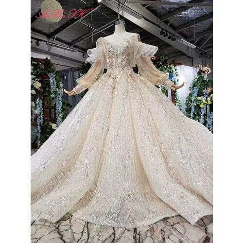 AnXin SH Luxury princess white flower lace boat neck beading crystal long sleeve champagne ruffles wedding dress 100% real photo