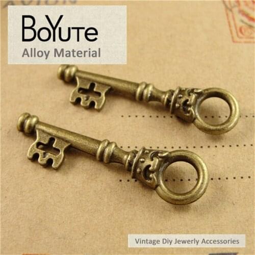 BoYuTe (50 Pieces/Lot) 35*9MM Antique Bronze Silver Plated Zinc Alloy Materials Skull Pendant Key Charms for Jewelry Making
