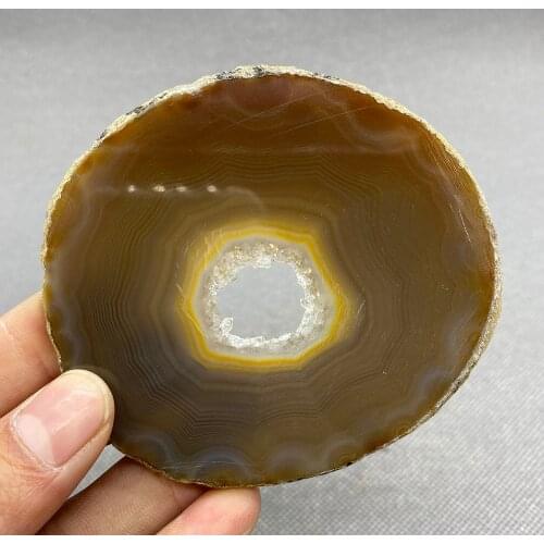 Natural agate slice polished ore specimen with crystal hole