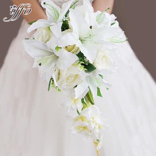 Iffo high-end custom bride hand holding flowers bouquet bride chestnut lily white rose green leaves with petals ribbon DIY decor
