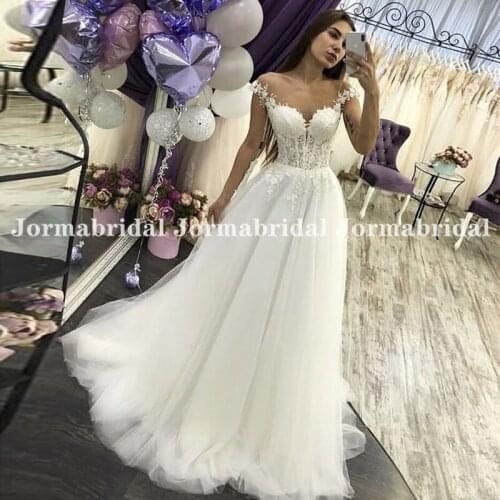 2021 White Tulle Boho Wedding Dresses Sheer Scoop Neckline Lace Appliques Cap Sleeves Beach Bridal Dress Formal Suknia ślubna