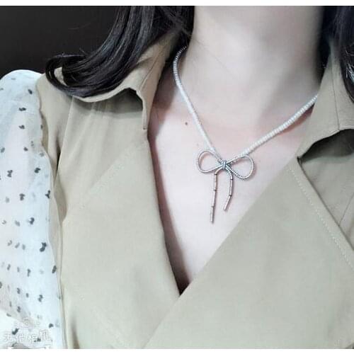 Free shipping Jewelry 6-7 mm natural south sea white pearl necklace micro inlay zircon bow pendant