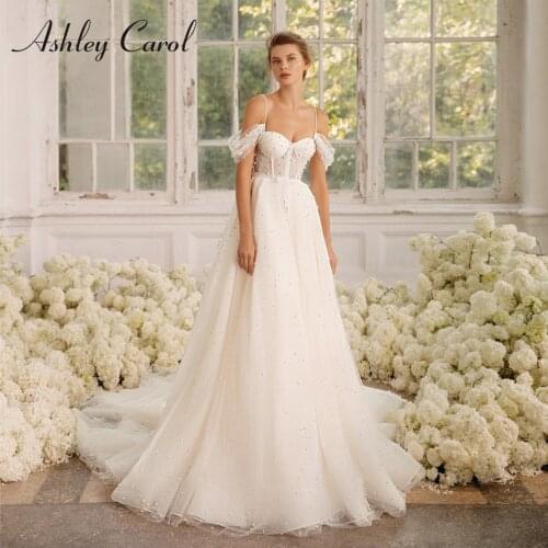 Ashley Carol A-Line Wedding Dress 2021 Charming Beaded Sweetheart Spaghetti Straps Bride Backless Princess Pearls Bridal Gowns