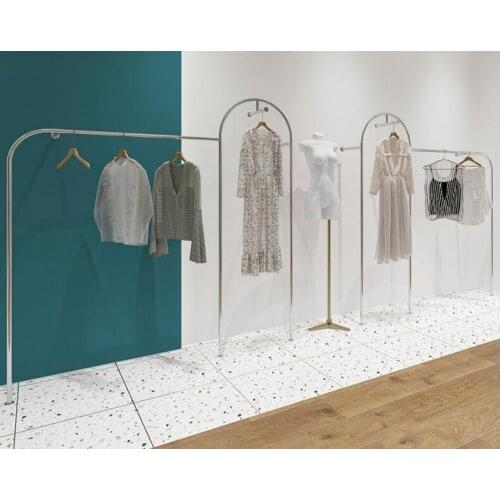 Stainless steel silver brushed lock wall shelf. Clothing display rack