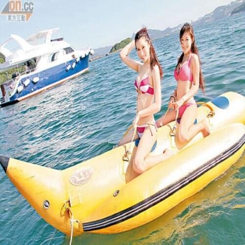 Inflatable banana boat 2 people playing on the beach surf riding water game water toys