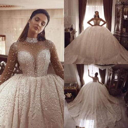 Arabic Luxurious Sexy Gorgeous Wedding Dresses Beaded Pearls Bridal Dresses Long Sleeves Wedding Gowns 2022