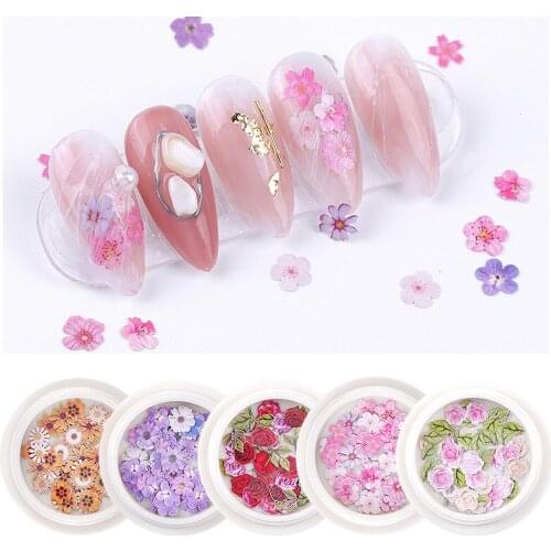 A box of Nail Art Jewelry Wood Pulp Chips Mixed Simulation Flowers Daisy Rose Environmentally Friendly DIY Nail Decor Slices