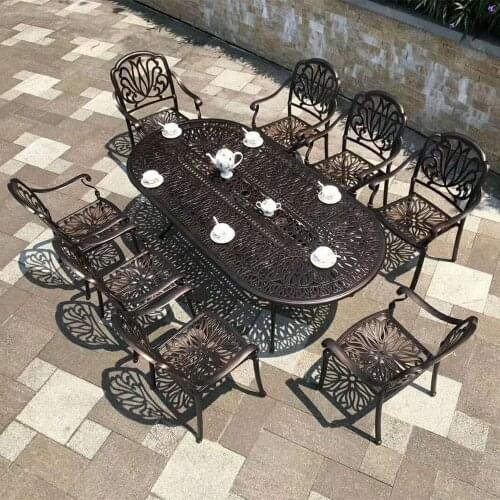 Set of 9pcs outdoor furniture solid-cast dining set oval table and 8 chairs in the yard or garden bronze color
