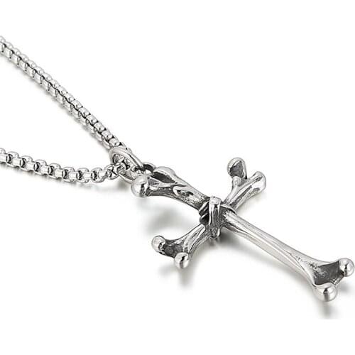 Creative new accessories European and American personality fashion street shooting cross bone titanium steel mens pendant