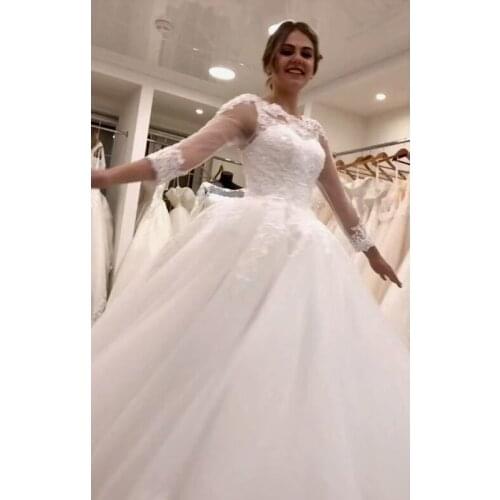 Eye Catching Ball Gown Wedding Dresses Three Quarter Sleeves Bridal Gowns Soft Tulle with Floral Applique Sparking Beads Crystal