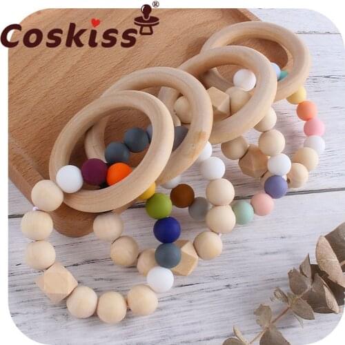 Coskiss BPA Free Wooden Ring Baby Teether Rainbow Silicone Beads Teether Bracelets Newborn Teething Toys Rodent Molar Toys