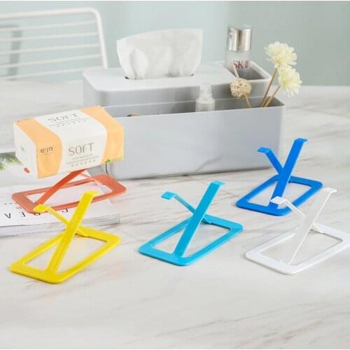 The bottom of the tissue box, the elastic device, lift the paper sheet, the bottom support of the elastic tissue box